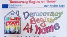 plakat projektu Democracy begines at home